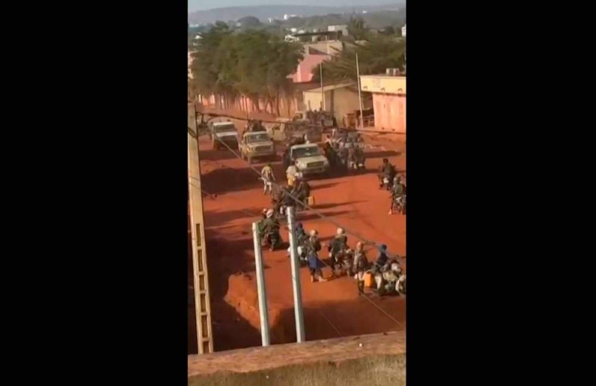 UGC video still showing armed militants moving through the streets of Kati, Mali