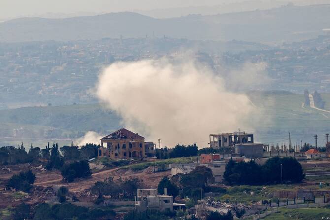 Smoke rises over the southern Lebanese village of Taybeh near the border as seen from Upper Galilee
