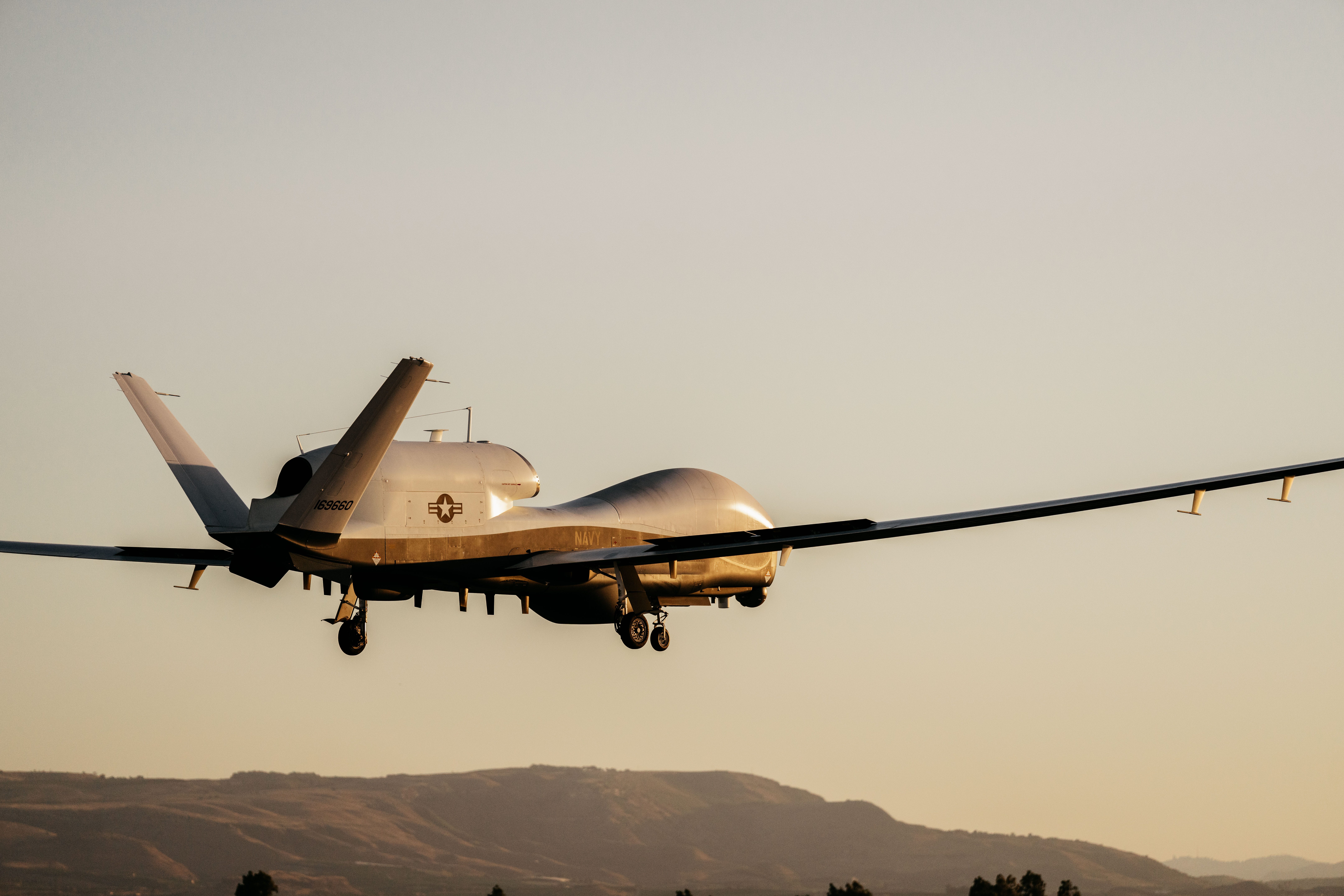 MQ-4C Triton drone at NAS Sigonella, Italy — the same model confirmed lost over the Persian Gulf on April 9 2026 during Operation Epic Fury, the first-ever combat loss of this aircraft